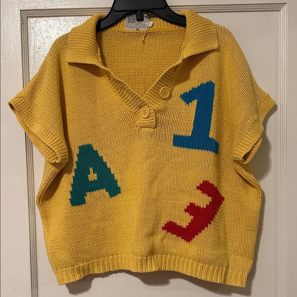 Yellow Collared Sweater with Colorful Letters